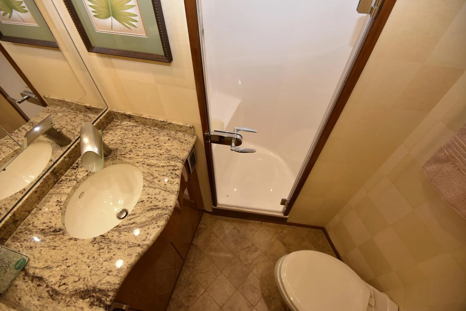 a bathroom with a sink and a toilet aboard SALTY K Yacht for Sale