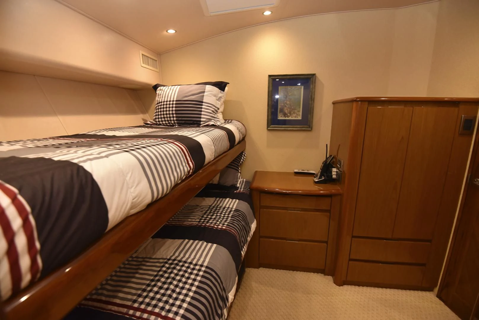 a bedroom with two beds aboard SALTY K Yacht for Sale