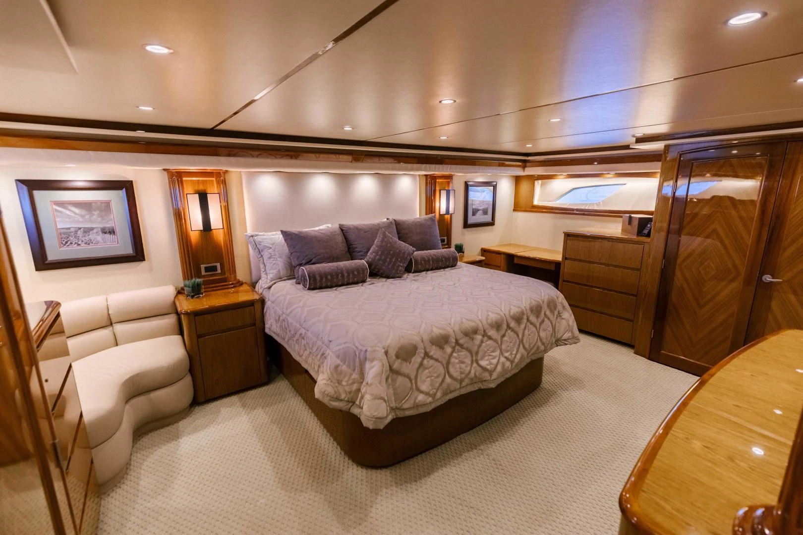 a large bedroom with a large bed aboard SALTY K Yacht for Sale