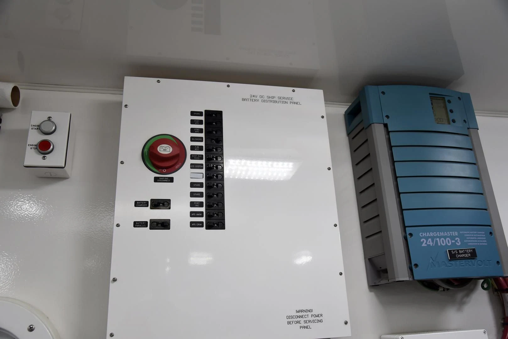 a white box with a red button and a blue box with a black label on it aboard SALTY K Yacht for Sale