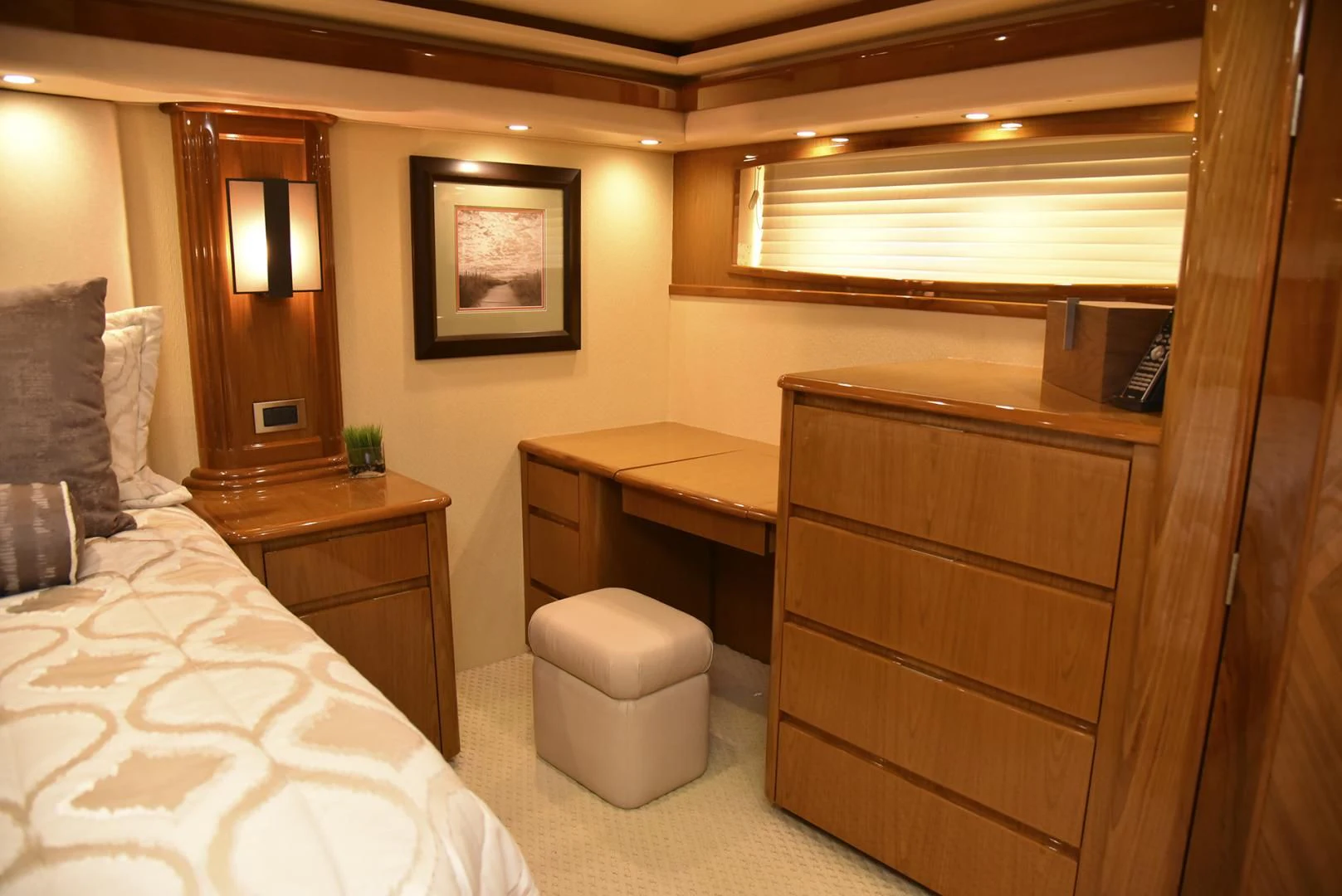 a bedroom with a bed and a desk aboard SALTY K Yacht for Sale