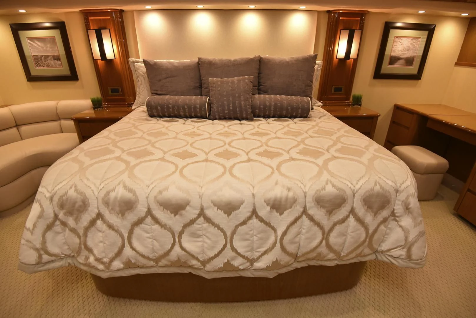 a bed with a white comforter aboard SALTY K Yacht for Sale