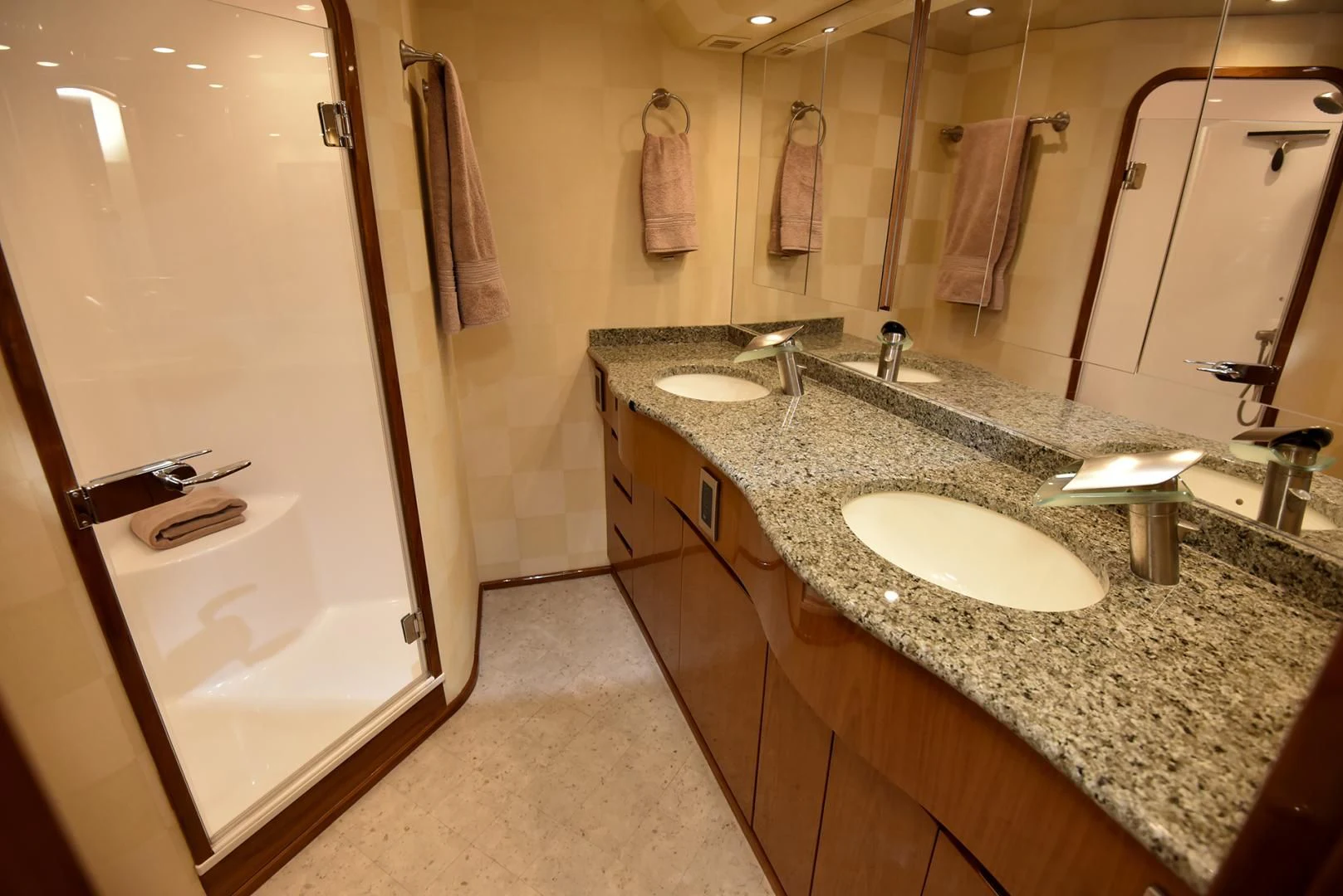 a bathroom with marble counter tops aboard SALTY K Yacht for Sale