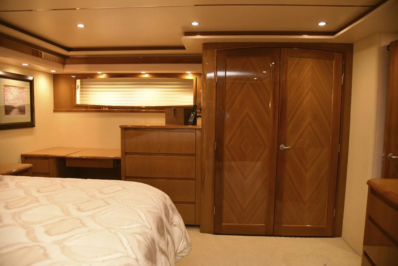 a bedroom with a closet and a bed aboard SALTY K Yacht for Sale