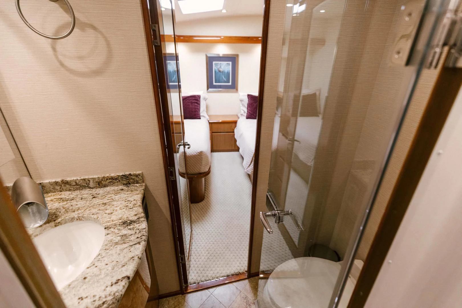a bathroom with a sink and shower aboard SALTY K Yacht for Sale