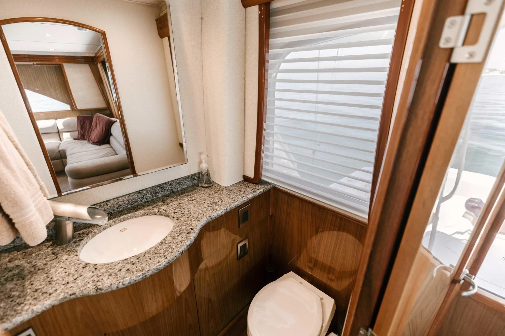 a bathroom with a sink and a mirror aboard SALTY K Yacht for Sale