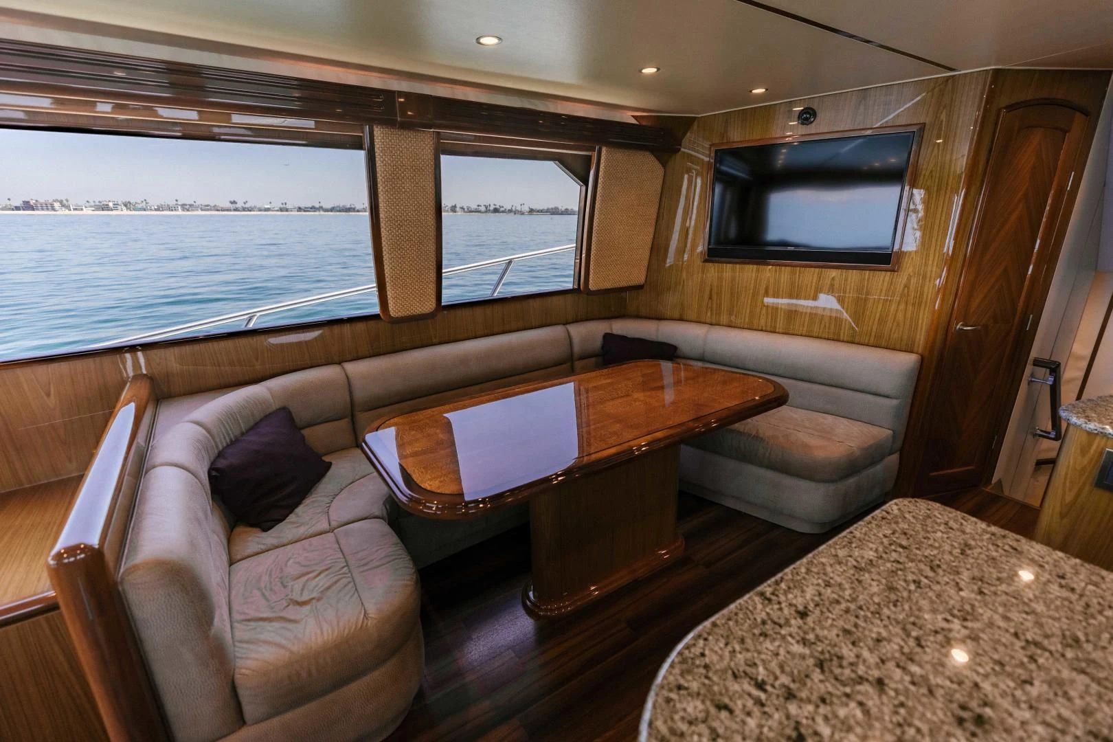 a living room with a couch and a table aboard SALTY K Yacht for Sale