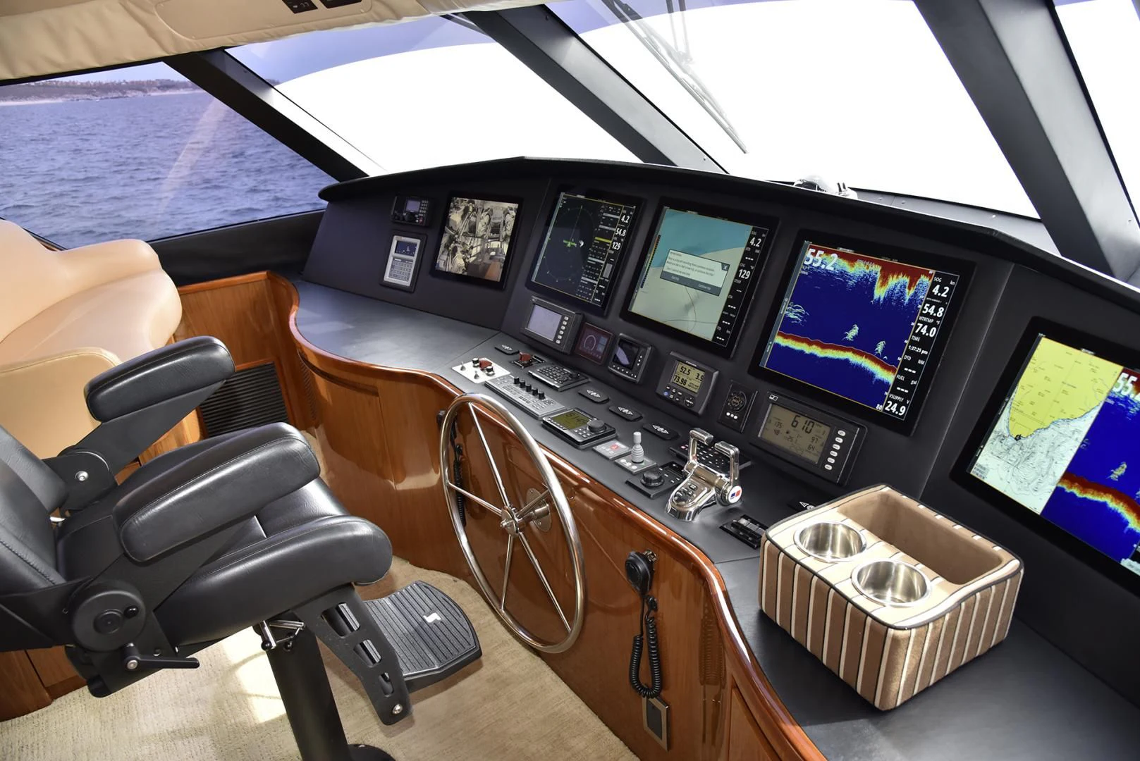 a room with many monitors and electronics aboard SALTY K Yacht for Sale