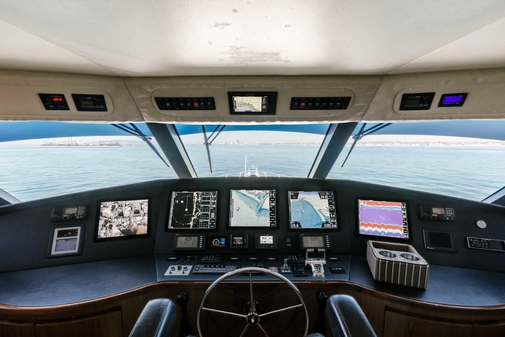 inside of a vehicle with monitors and keyboards aboard SALTY K Yacht for Sale