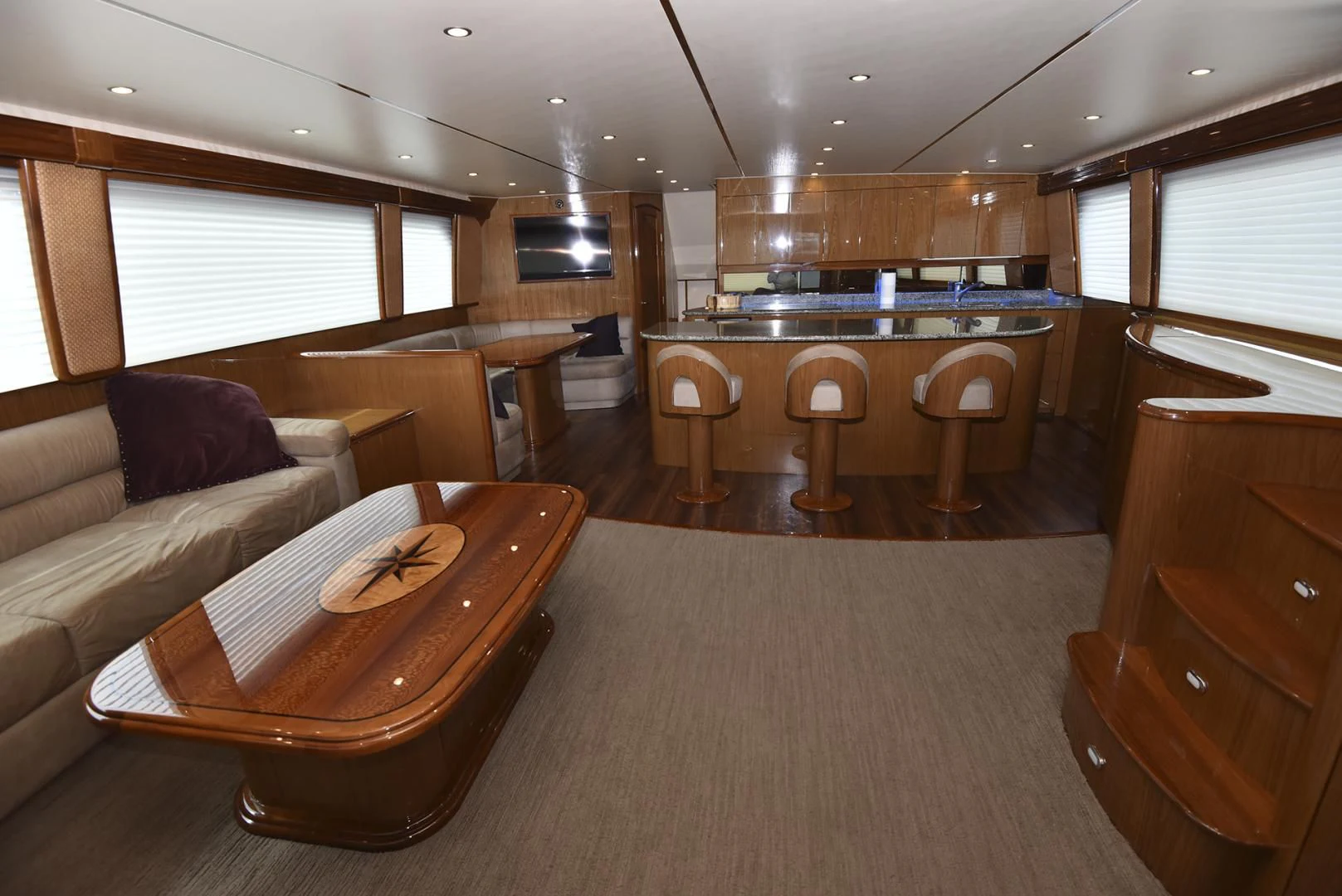 a living room with a couch and a table aboard SALTY K Yacht for Sale
