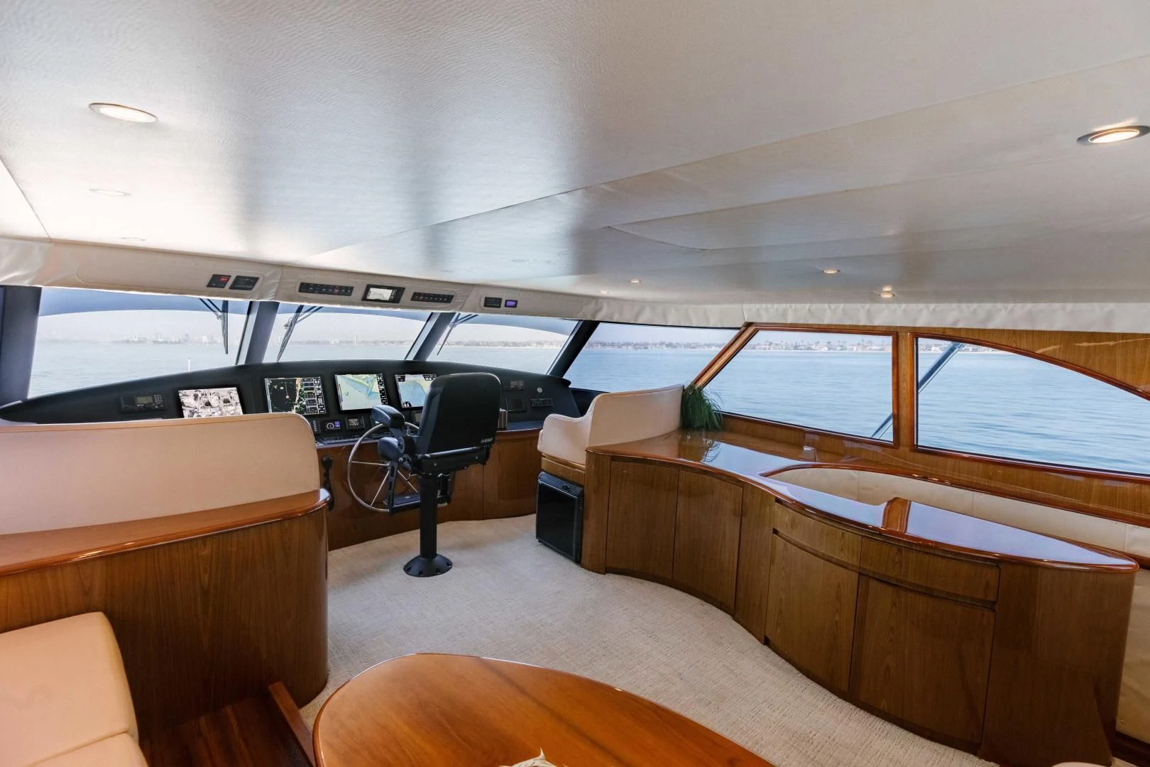 a room with a desk and chairs aboard SALTY K Yacht for Sale