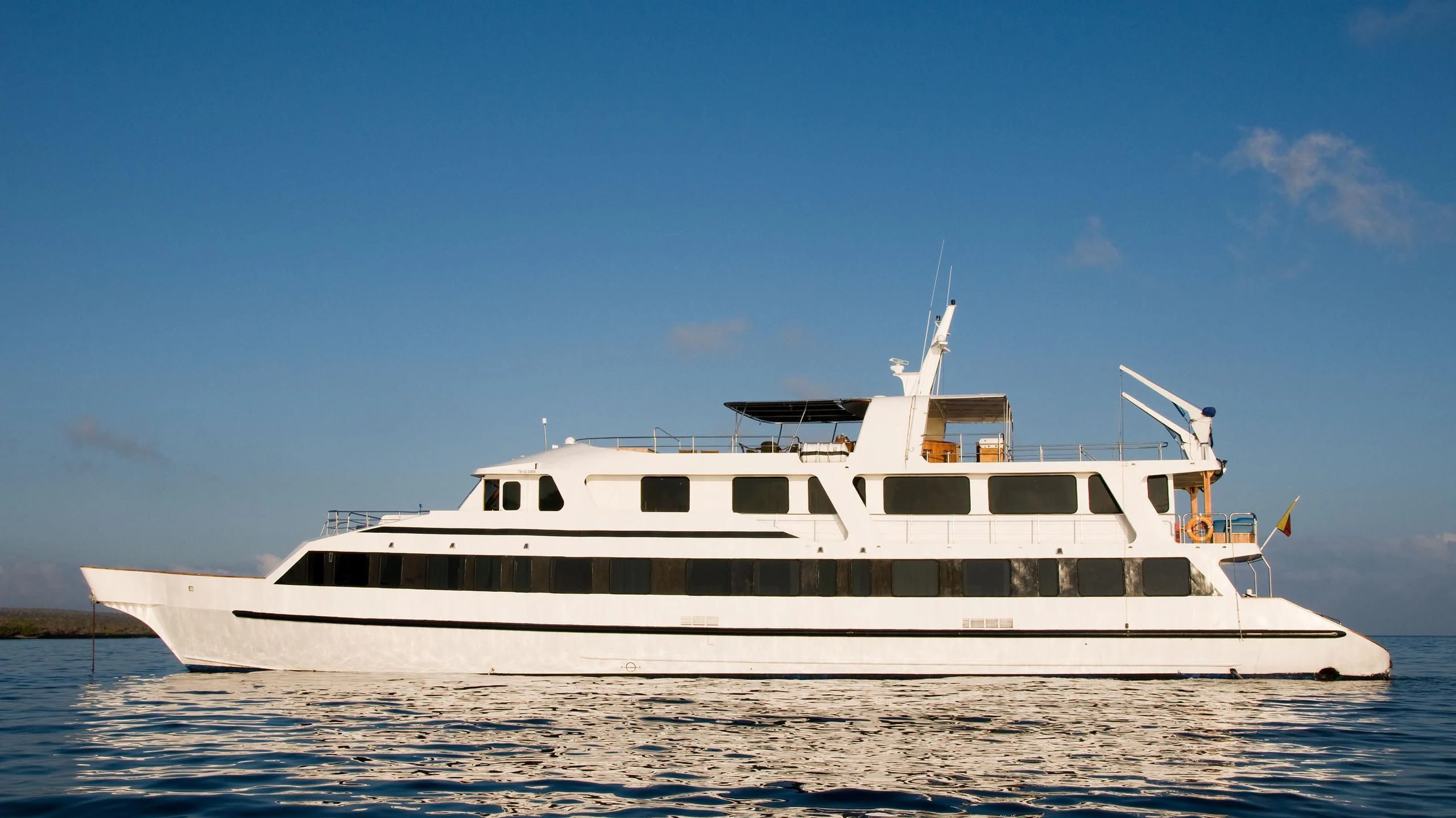 a white yacht on the water aboard INTEGRITY Yacht for Sale