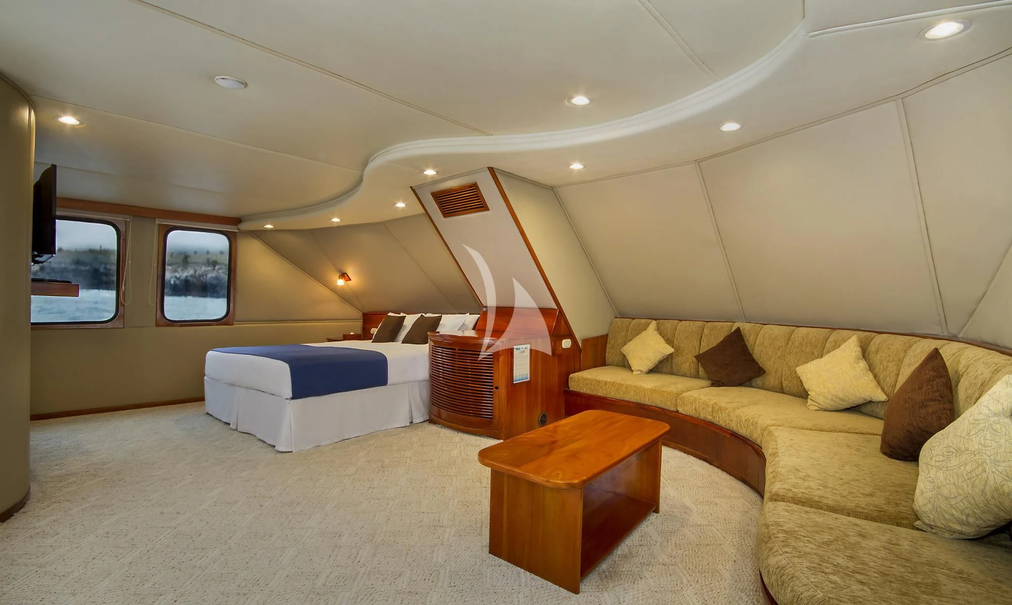 a living room with a couch and a coffee table aboard INTEGRITY Yacht for Sale