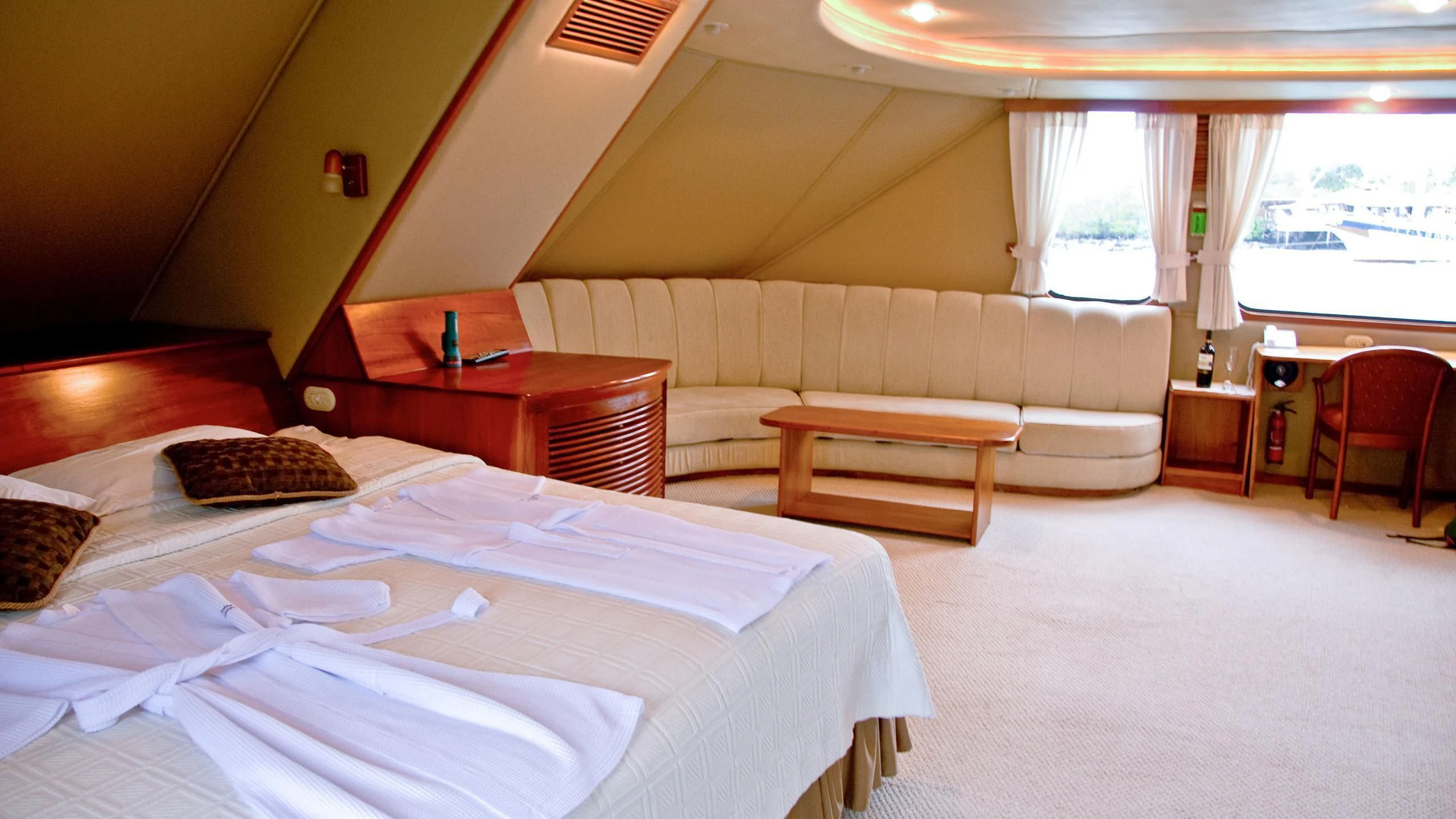 a room with a bed and a couch aboard INTEGRITY Yacht for Sale