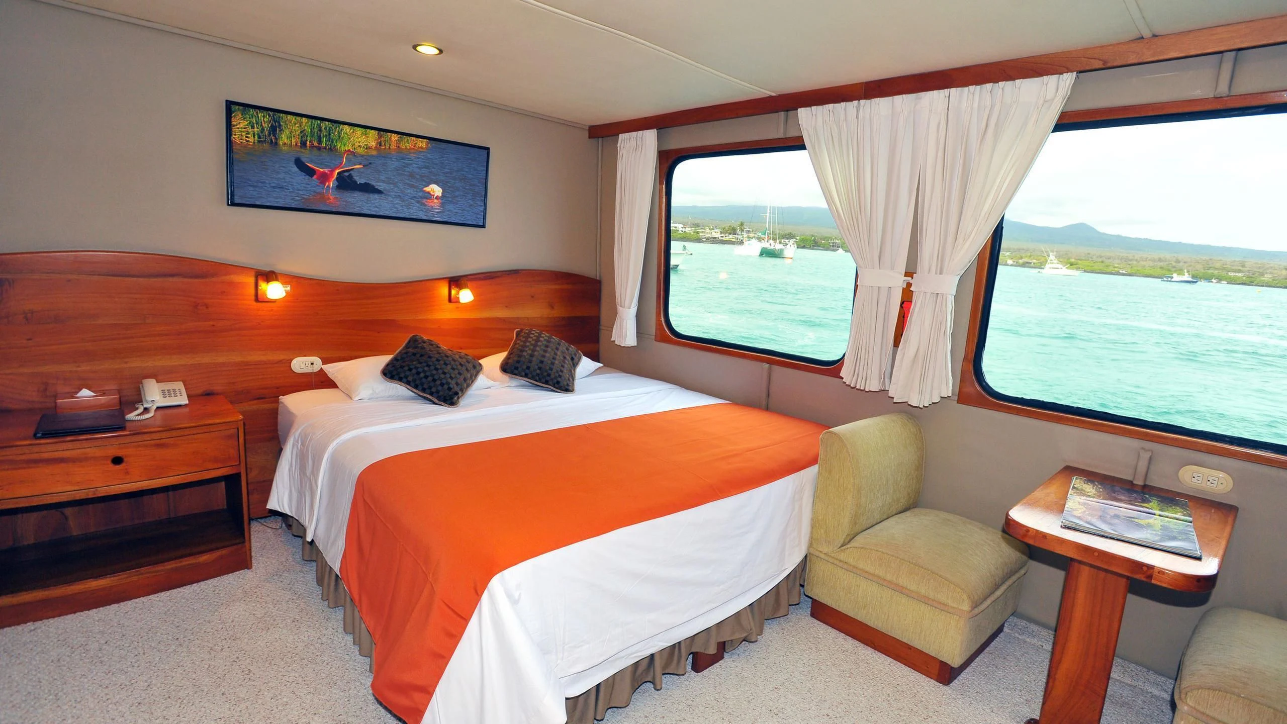a room with a bed and a chair aboard INTEGRITY Yacht for Sale