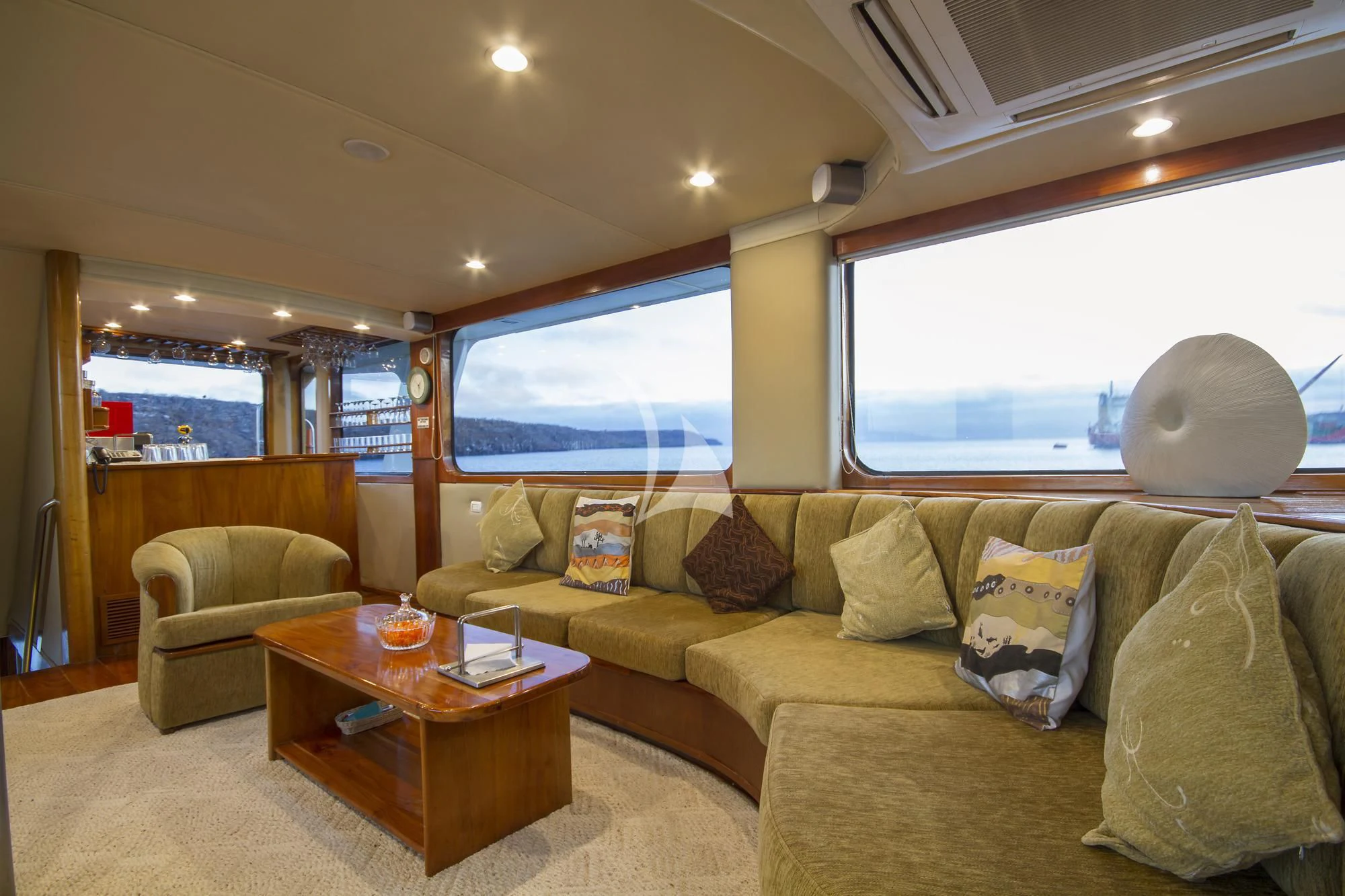 a living room with a couch and a table aboard INTEGRITY Yacht for Sale