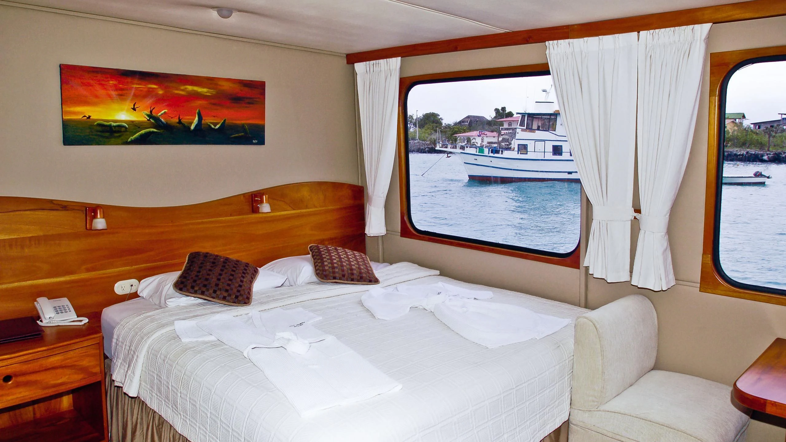 a room with a bed and a window aboard INTEGRITY Yacht for Sale