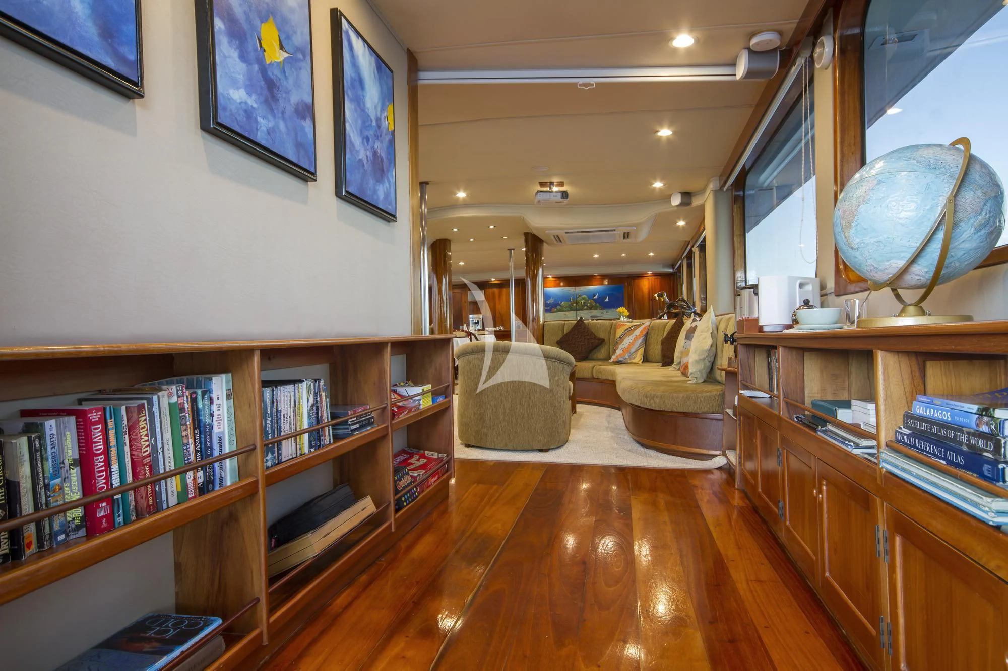 a living room with a wood floor aboard INTEGRITY Yacht for Sale