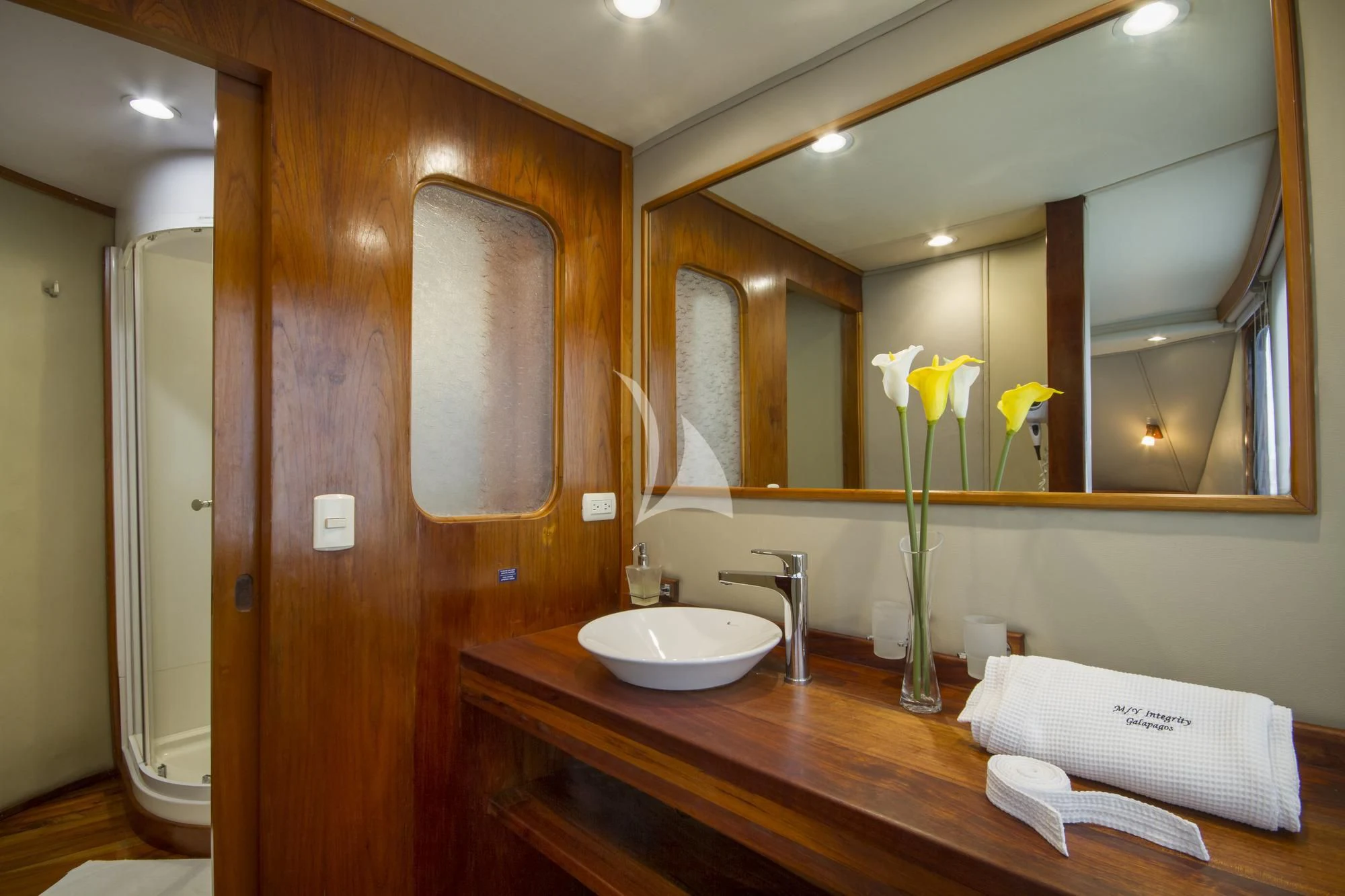 a bathroom with a large mirror aboard INTEGRITY Yacht for Sale