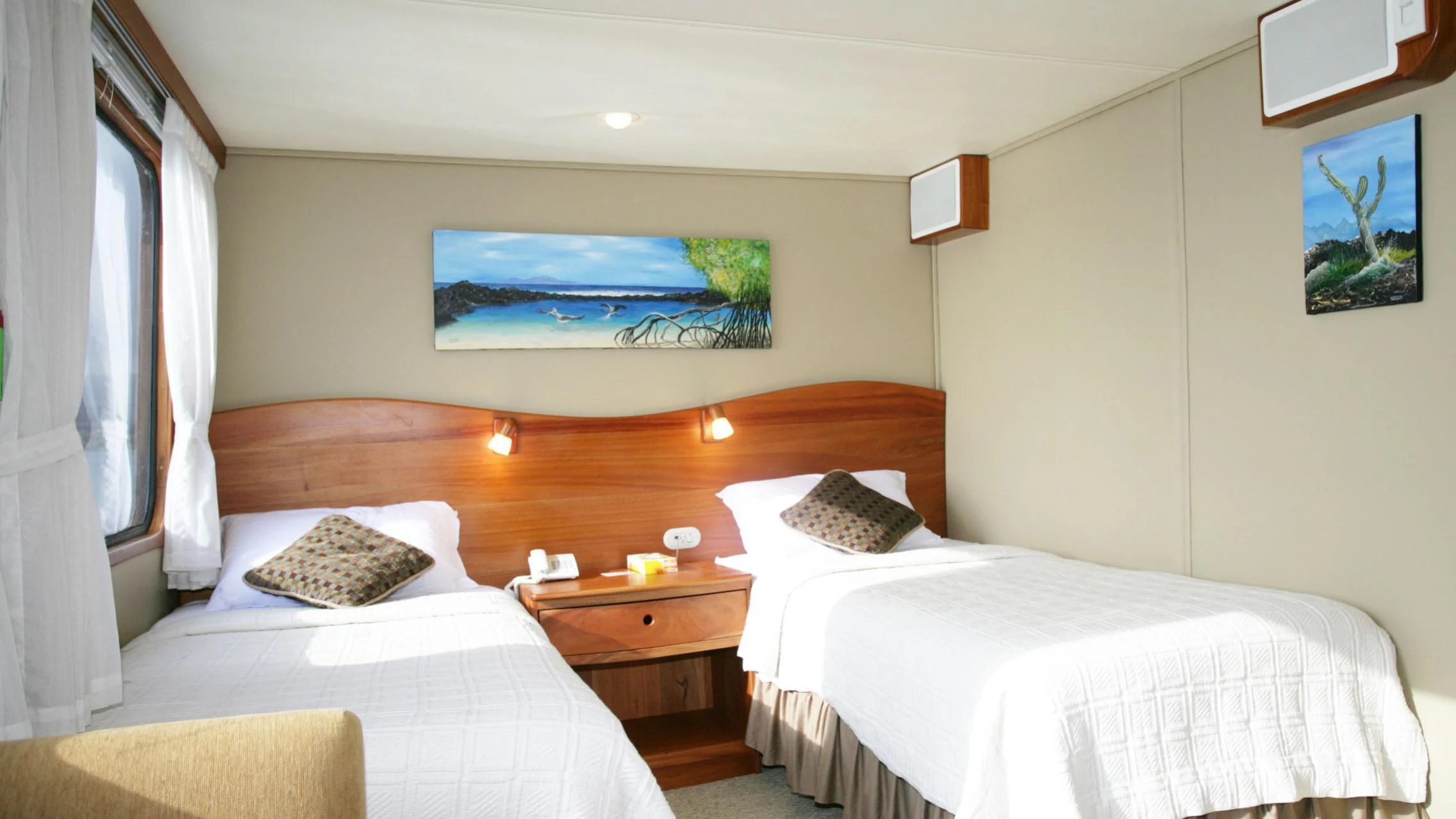 a couple of beds in a hotel room aboard INTEGRITY Yacht for Sale