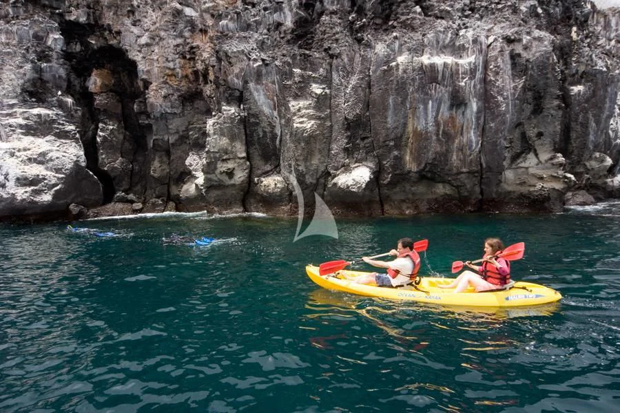 a group of people in kayaks in a body of water aboard INTEGRITY Yacht for Sale