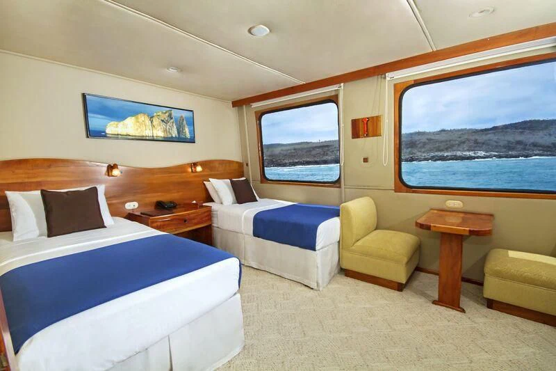 a room with a bed and a couch aboard INTEGRITY Yacht for Sale