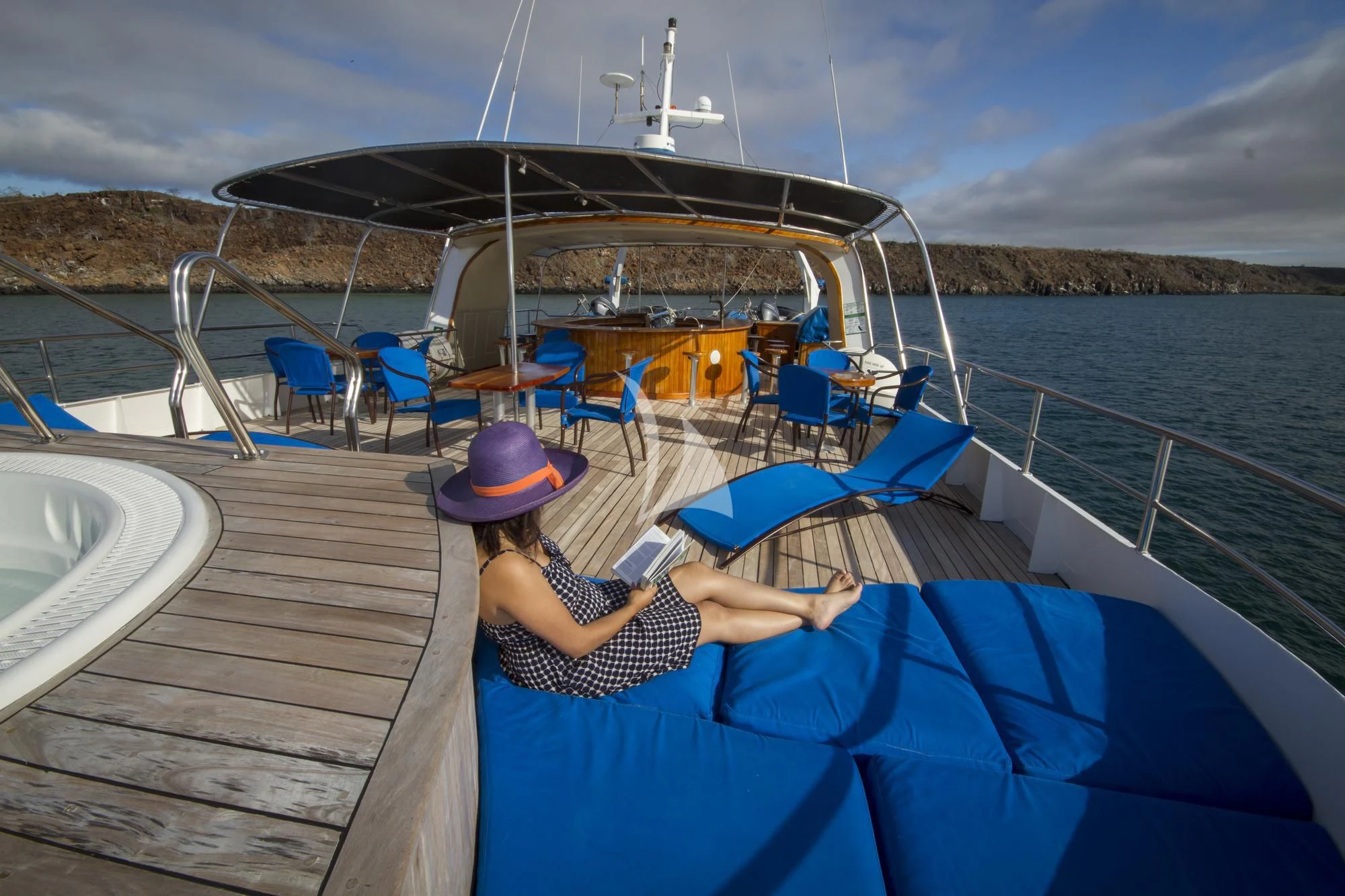 a person sitting on a dock aboard INTEGRITY Yacht for Sale