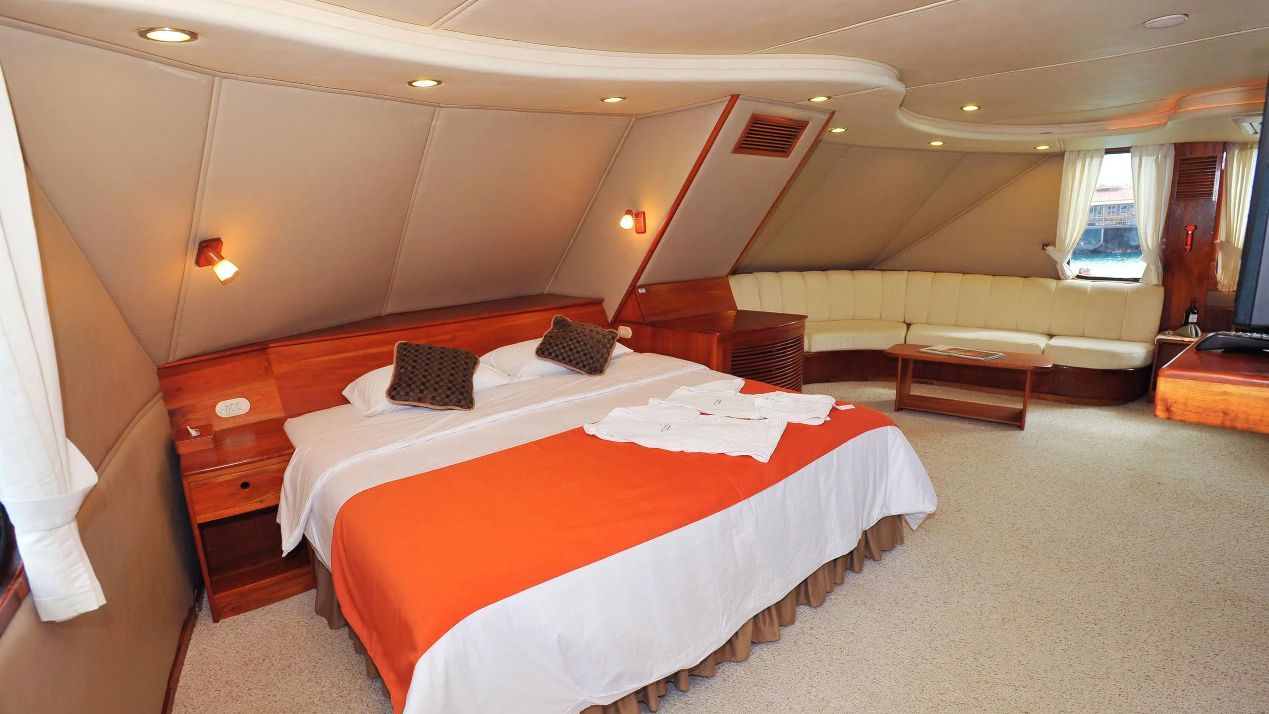 a room with a bed and a desk aboard INTEGRITY Yacht for Sale