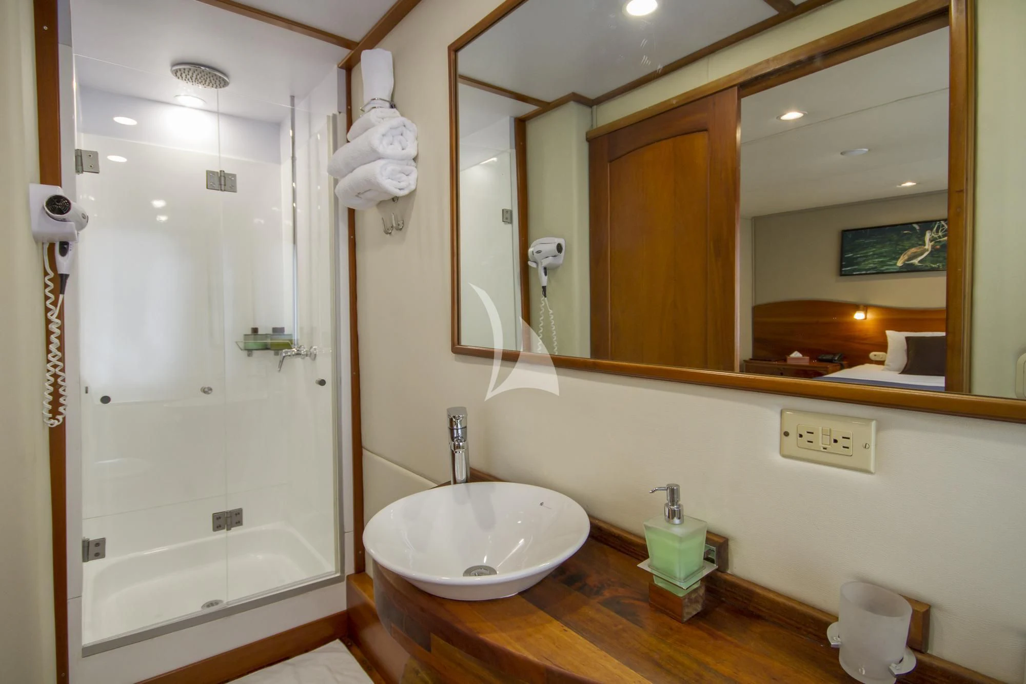 a bathroom with a shower and sink aboard INTEGRITY Yacht for Sale