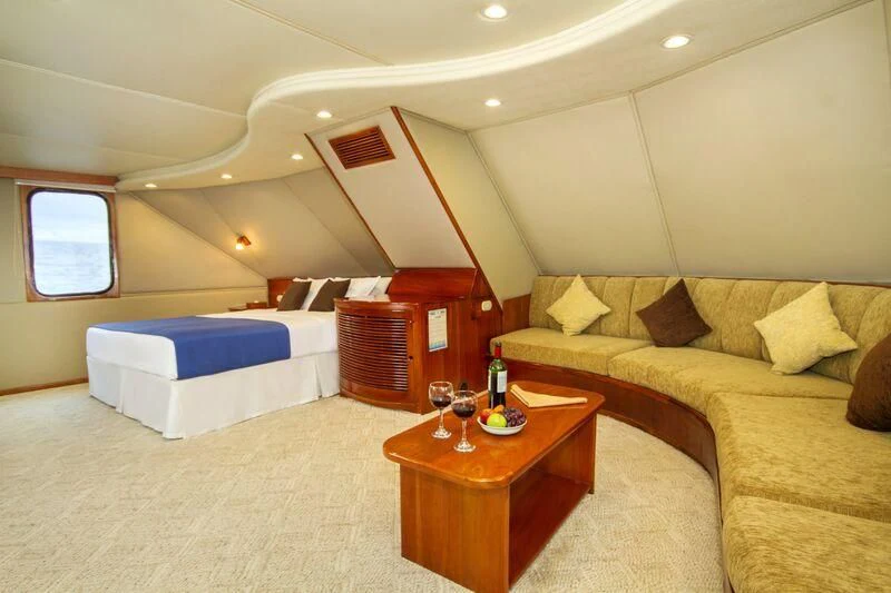 a living room with a couch and a coffee table aboard INTEGRITY Yacht for Sale
