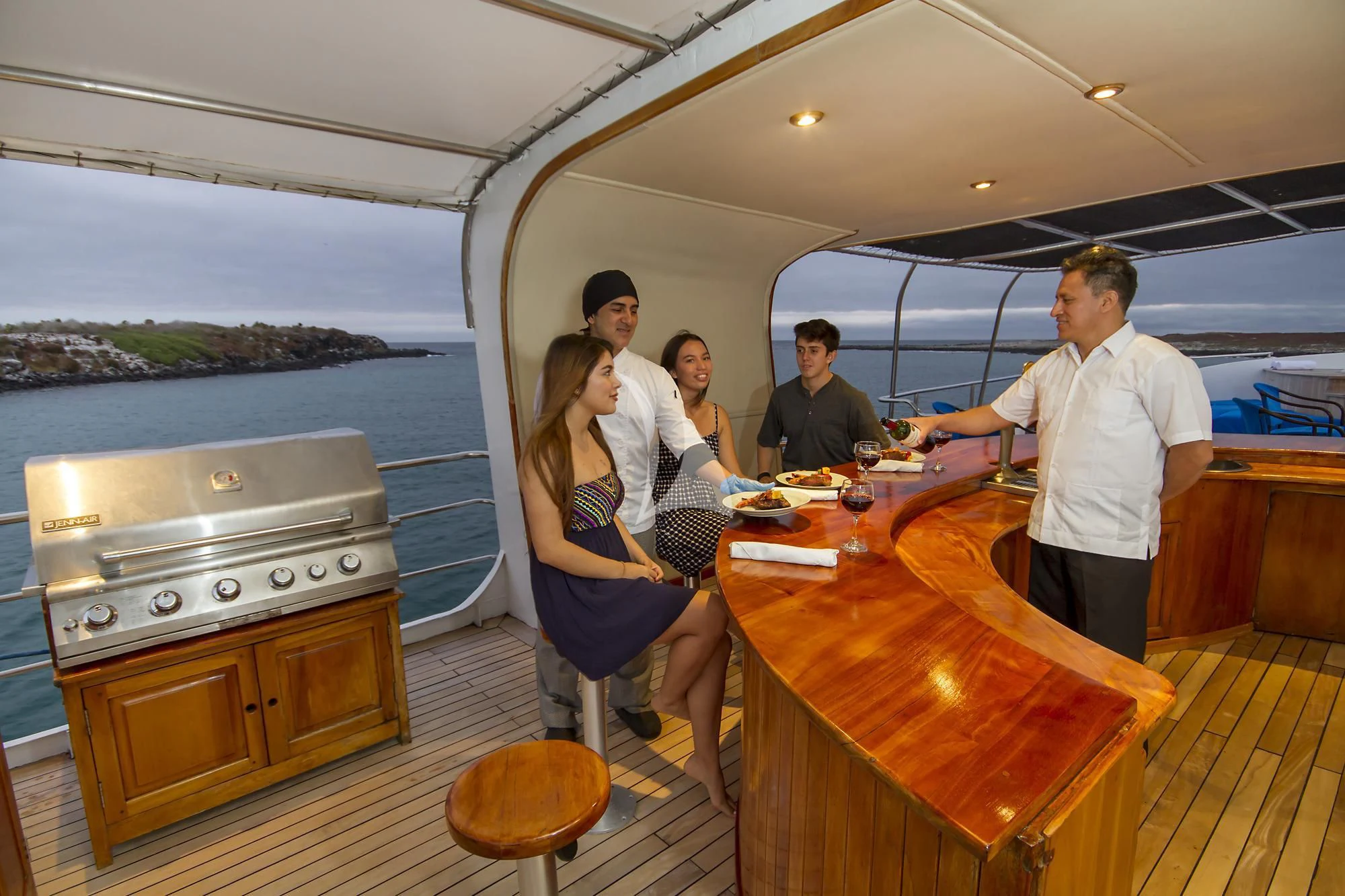a group of people eating at a restaurant aboard INTEGRITY Yacht for Sale