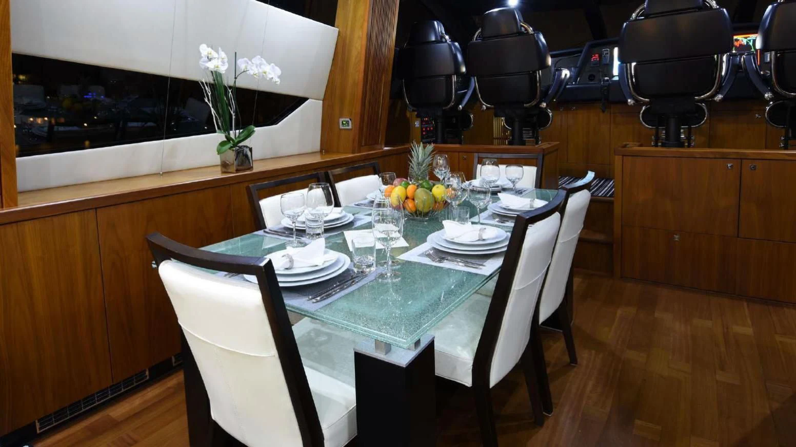 a table with plates and glasses on it aboard SKY FALL Yacht for Sale