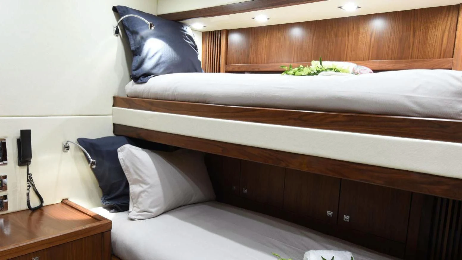 a bed with white sheets aboard SKY FALL Yacht for Sale