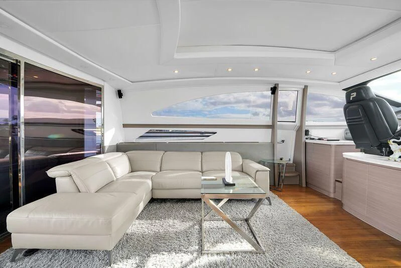 a living room with a couch and a table aboard GHOST Yacht for Sale