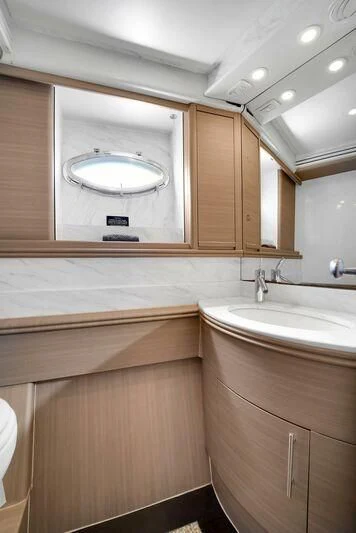 a bathroom with a large mirror aboard GHOST Yacht for Sale