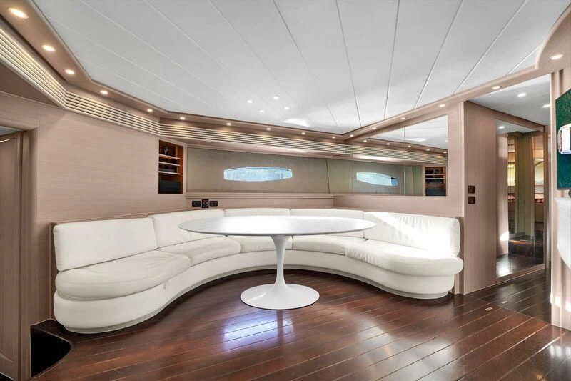 a room with a couch and a table aboard GHOST Yacht for Sale