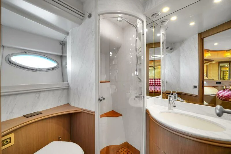 a bathroom with a glass shower aboard GHOST Yacht for Sale
