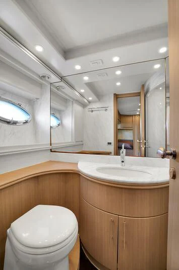 a bathroom with a toilet and a sink aboard GHOST Yacht for Sale