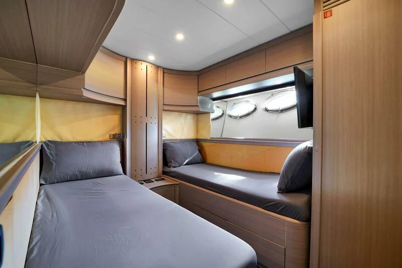 a cabin with a bed and a tv aboard GHOST Yacht for Sale
