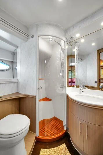 a bathroom with a shower and toilet aboard GHOST Yacht for Sale