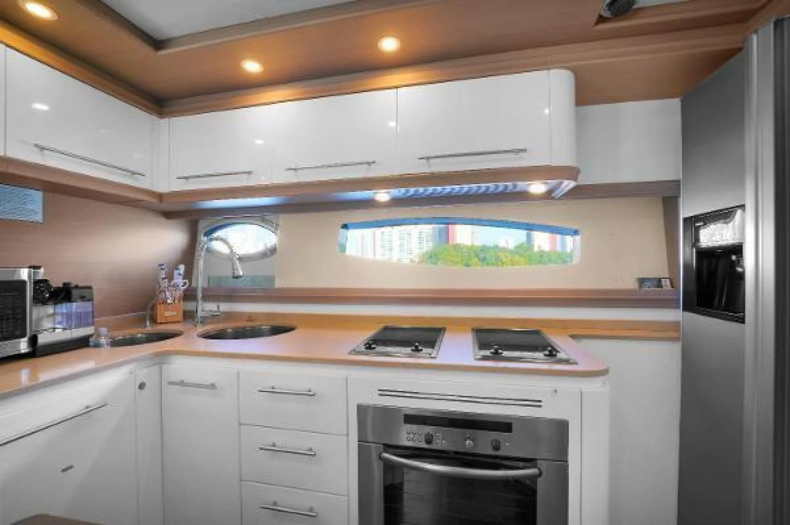 a kitchen with a large fish tank aboard GHOST Yacht for Sale