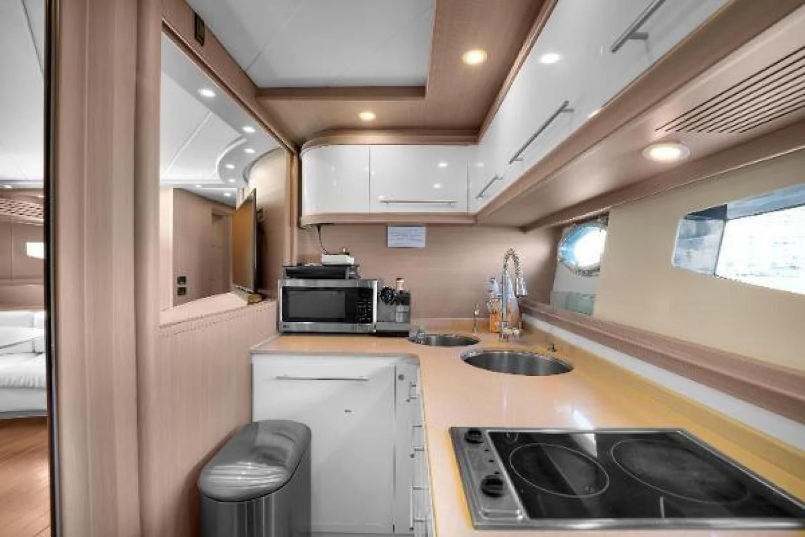 a kitchen with a sink and microwave aboard GHOST Yacht for Sale