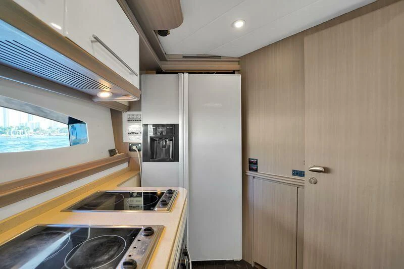a kitchen with a counter and cabinets aboard GHOST Yacht for Sale