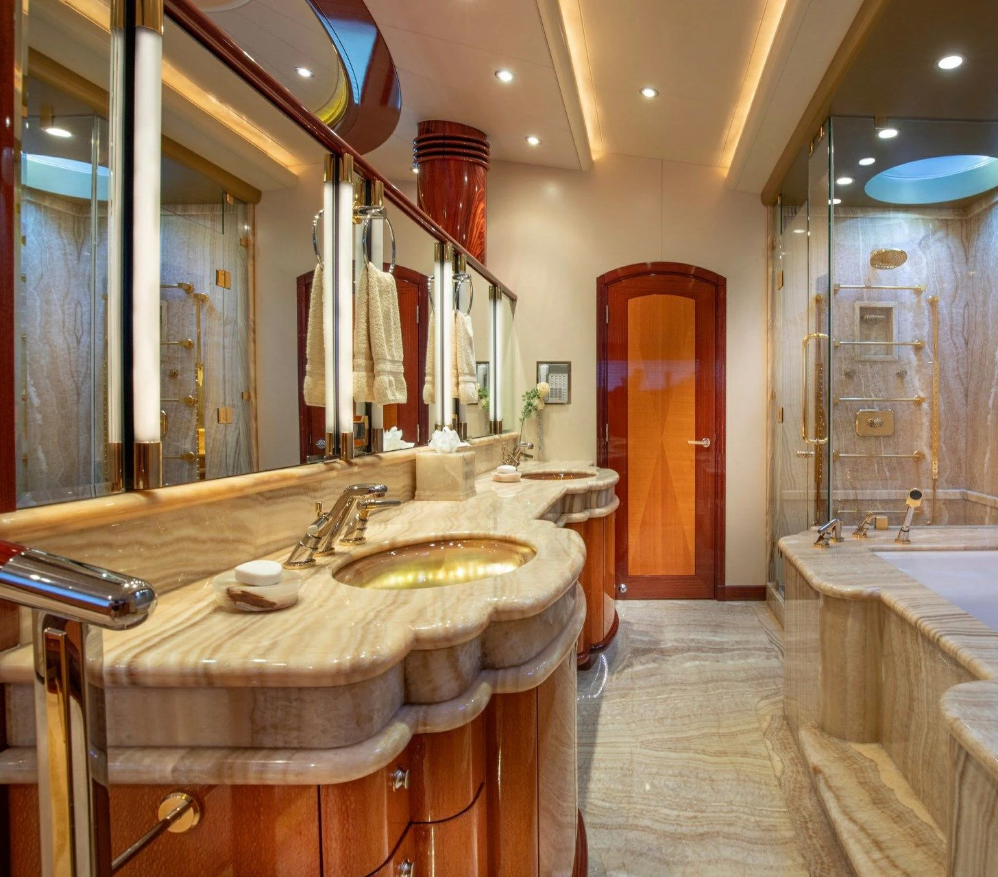 a bathroom with a large mirror aboard DRIVEN Yacht for Sale