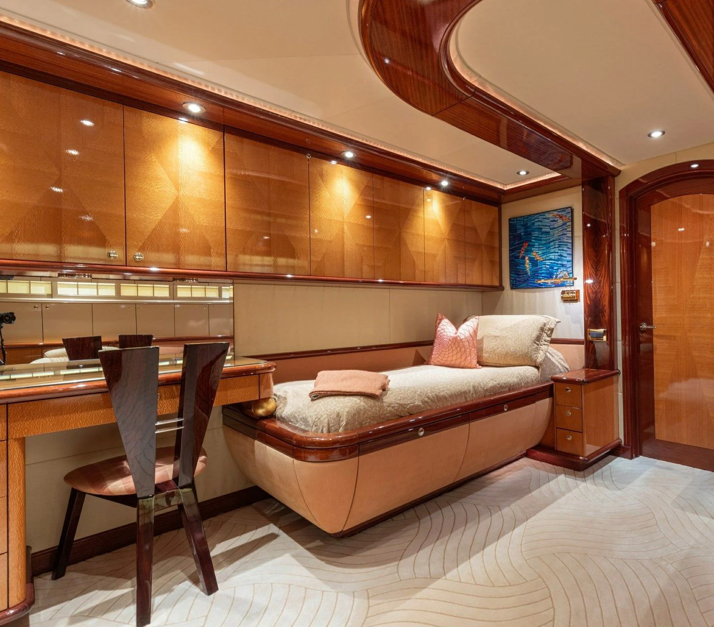 a room with a bed and a desk aboard DRIVEN Yacht for Sale