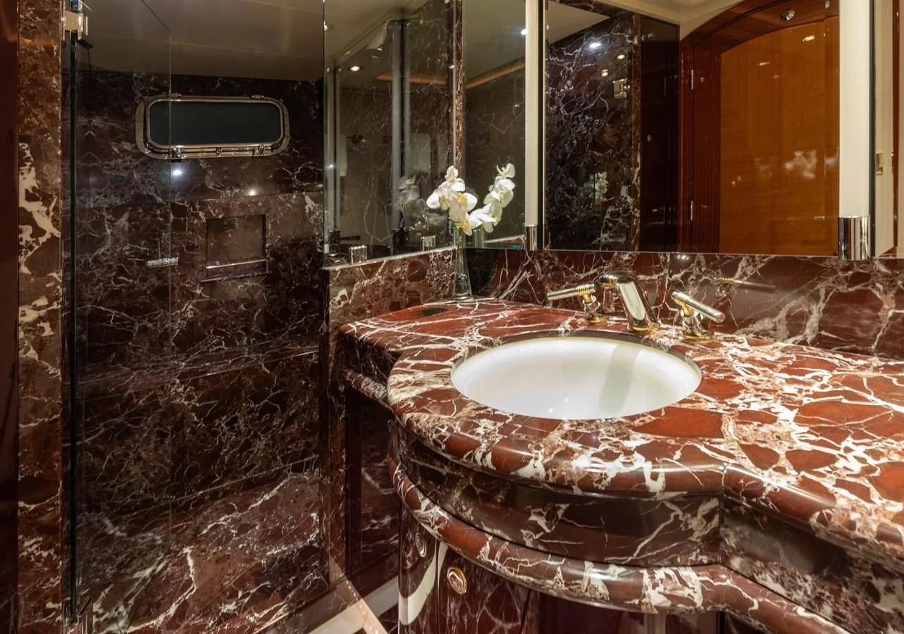 a bathroom with a sink and a mirror aboard DRIVEN Yacht for Sale