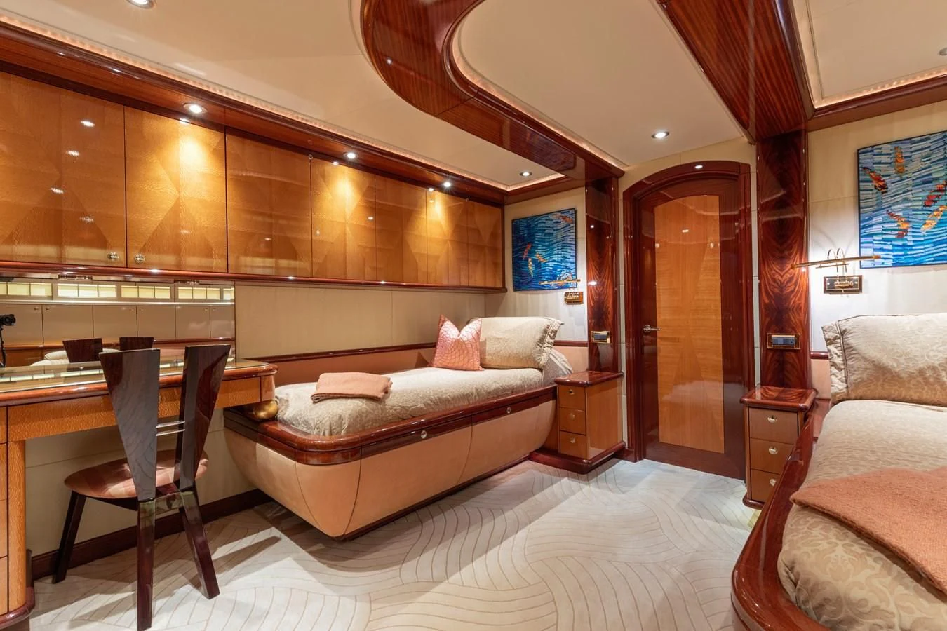 a hotel room with a bed and a desk aboard DRIVEN Yacht for Sale