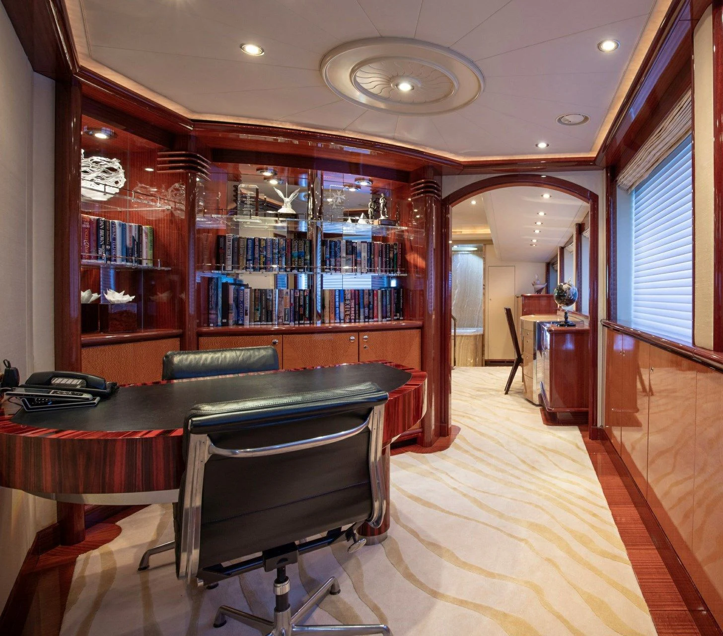 a room with a table and chairs aboard DRIVEN Yacht for Sale