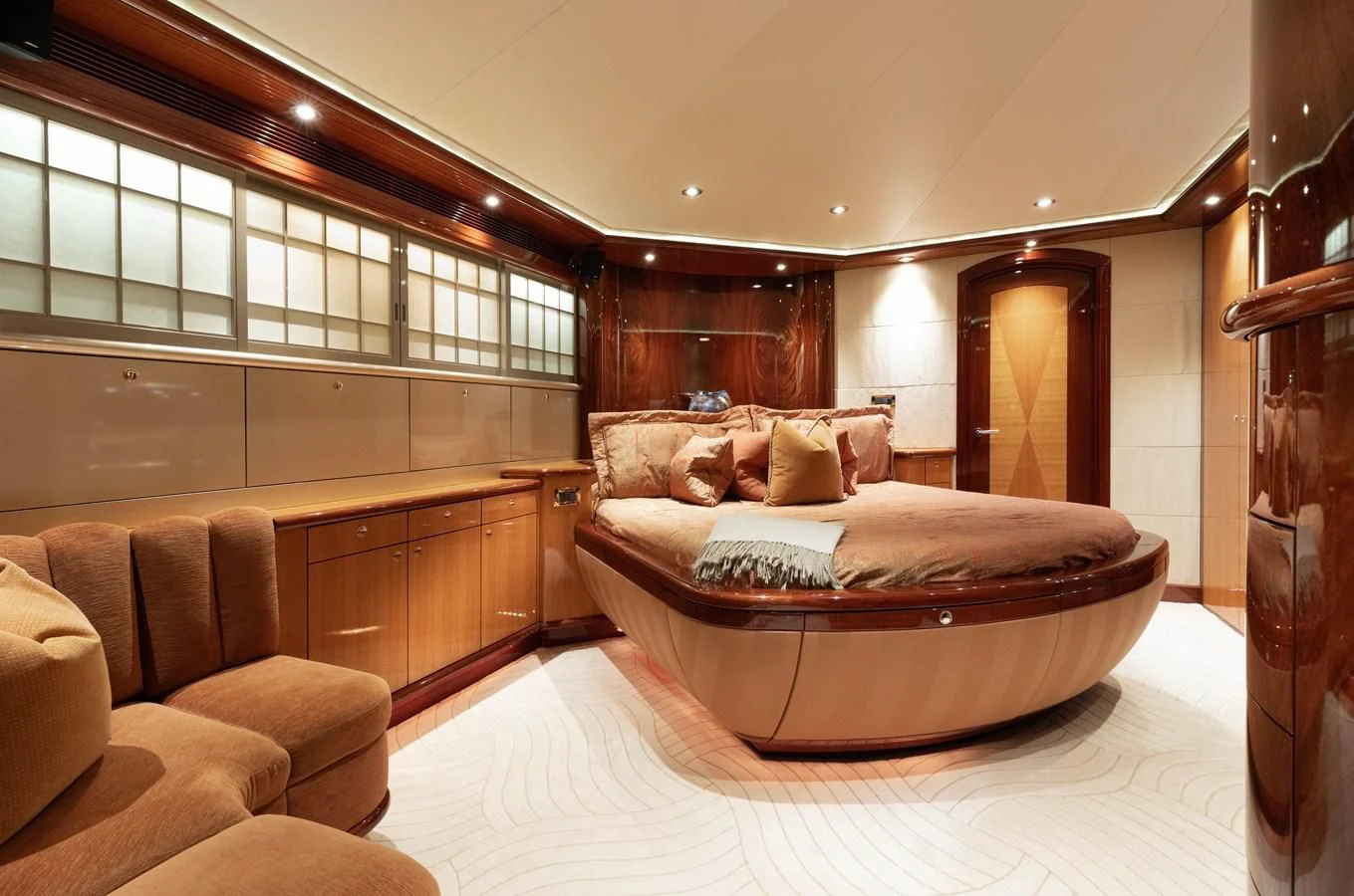 a large bed in a room aboard DRIVEN Yacht for Sale
