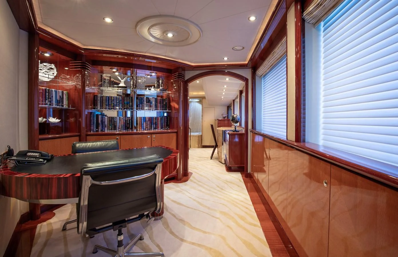 a room with a table and chairs aboard DRIVEN Yacht for Sale
